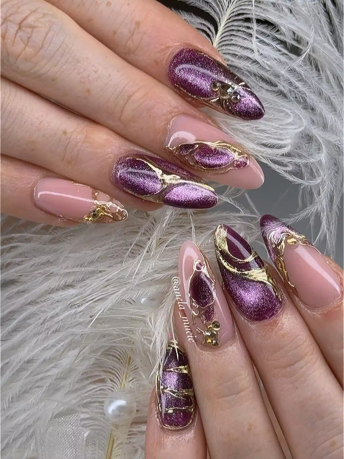 Nude and Purple Glitter-Metallic Nails with Raised Gold Flowing Lines and Rhinestone Accents