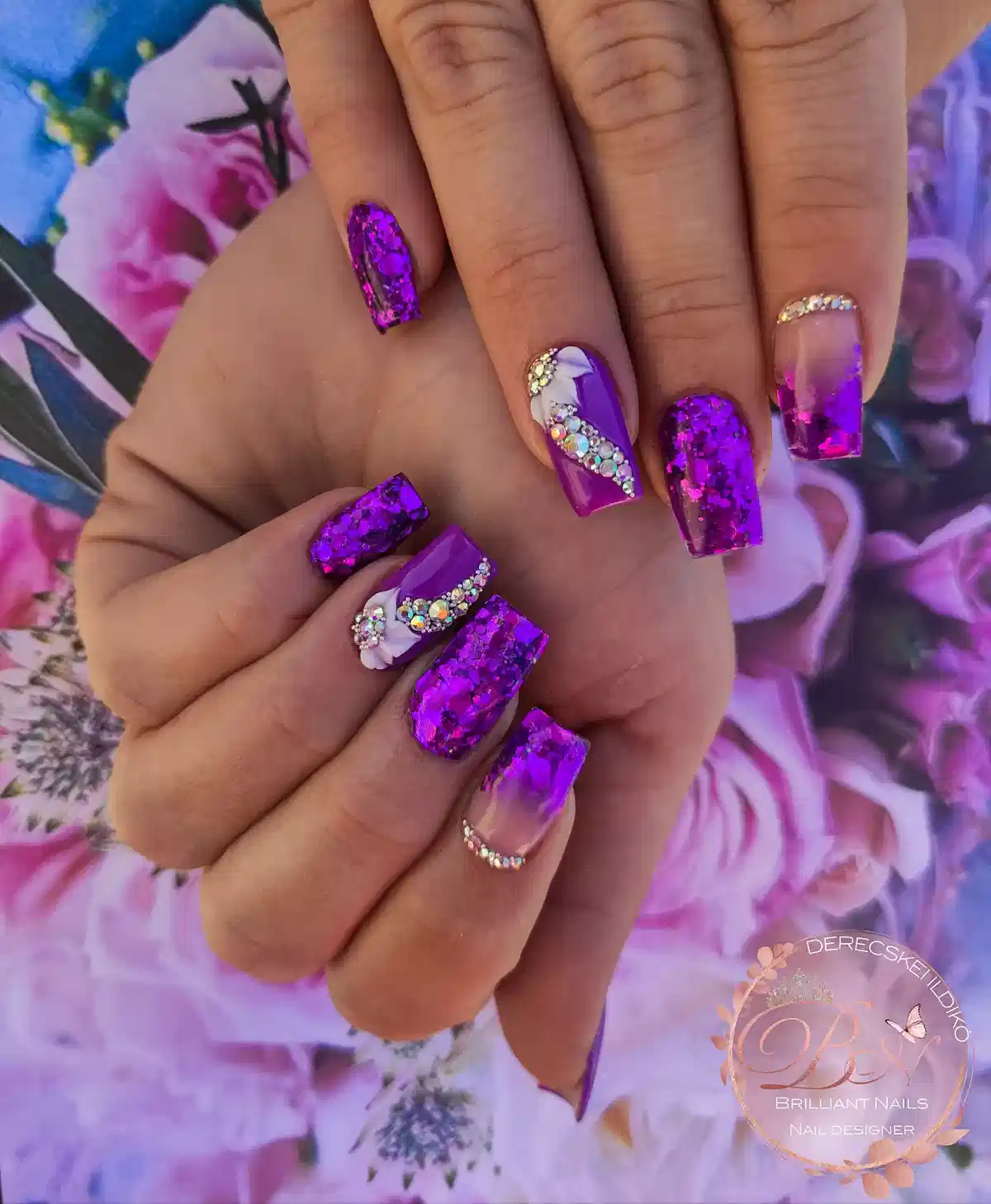 Bright purple reflective set with rhinestone curves and white floral accents