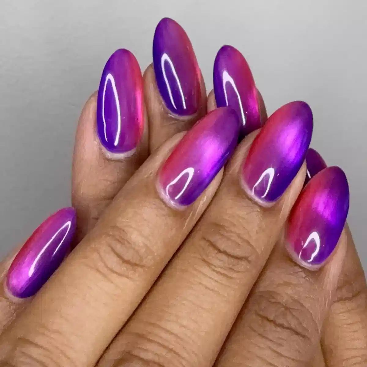 Glossy purple-to-magenta gradient nails