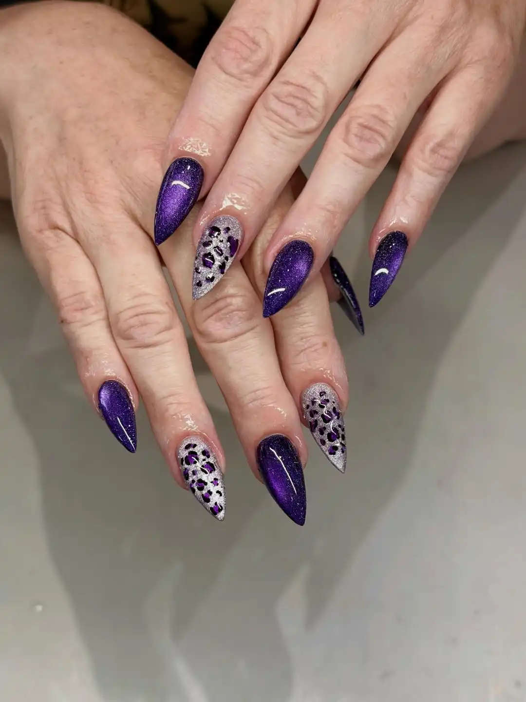 Dark purple shimmer with spotted silver accent nails