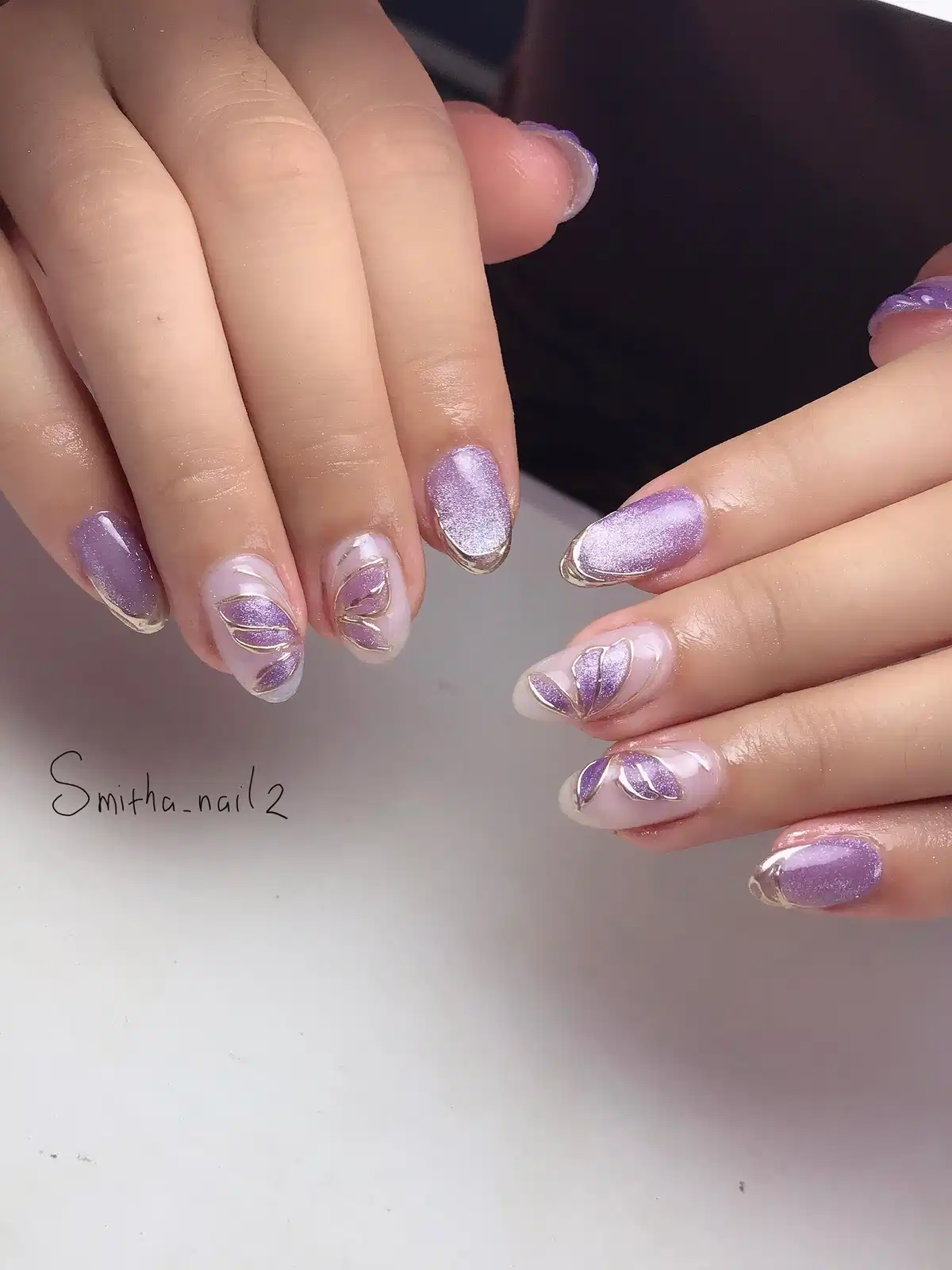 Pale purple shimmer with gold tip outlines and leaf accents