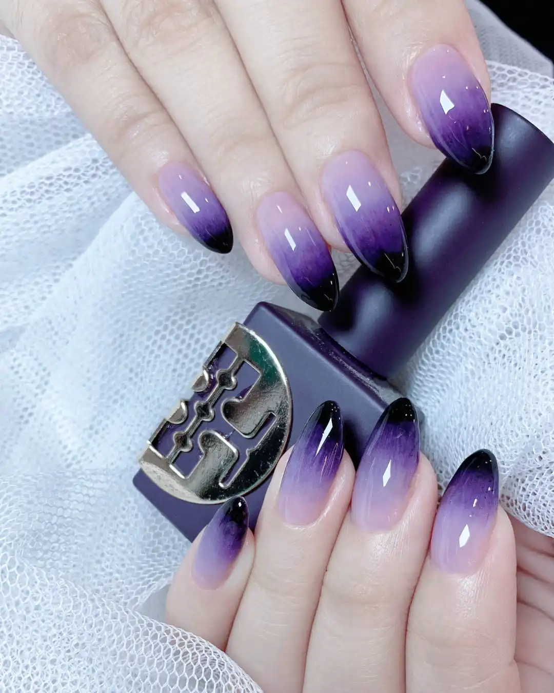 Lavender-to-deep purple ombré almond nails