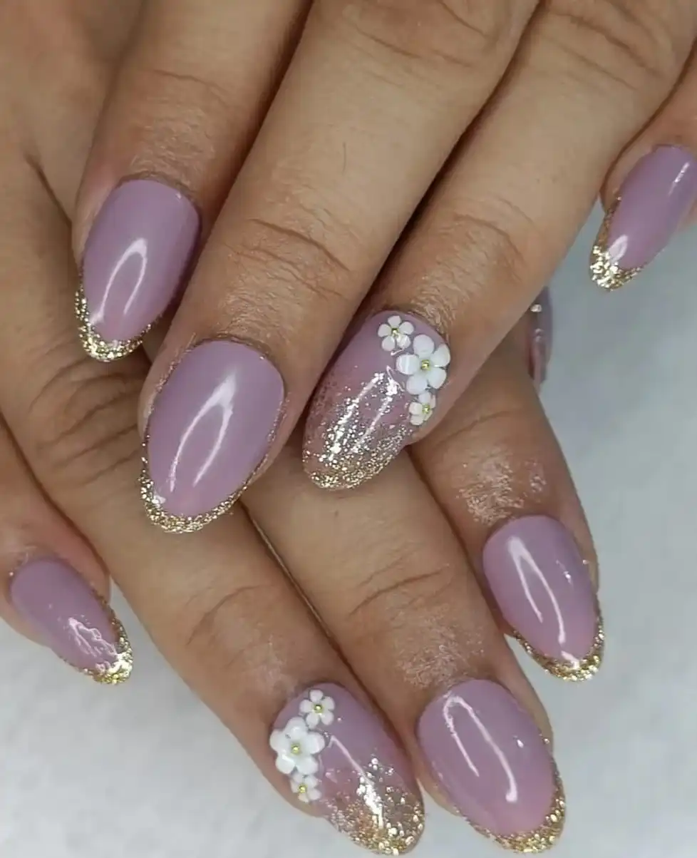 Soft lavender with gold glitter tips and white floral clusters
