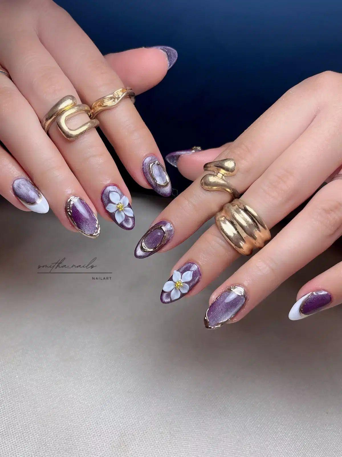 Metallic purple with gold-framed accents and white flowers