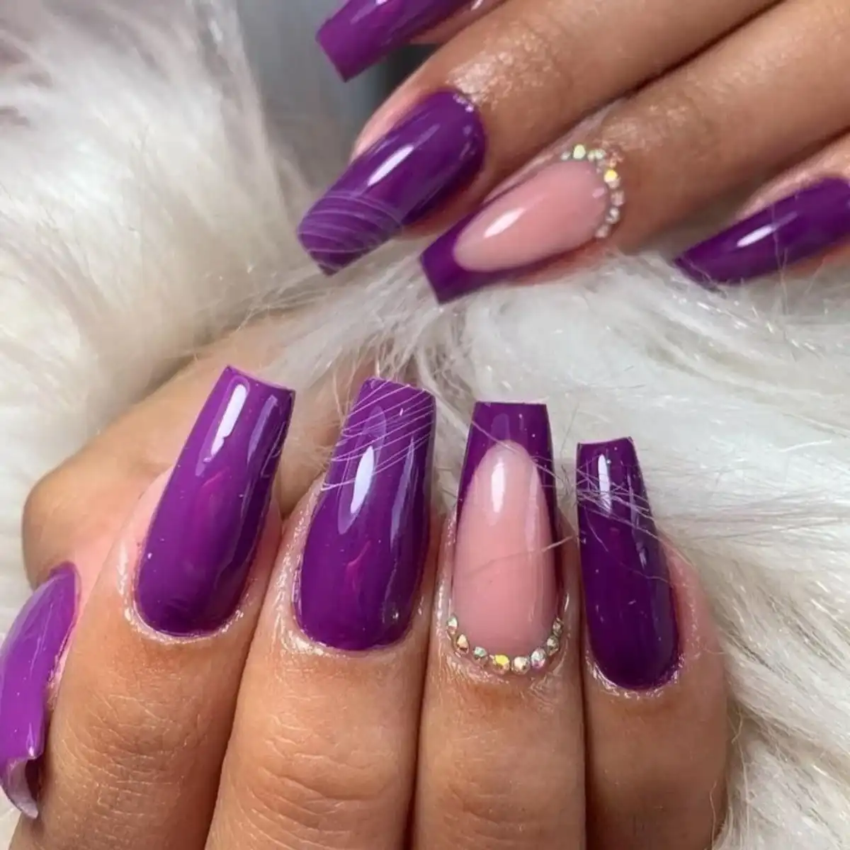 Glossy solid purple with rhinestone accent nail