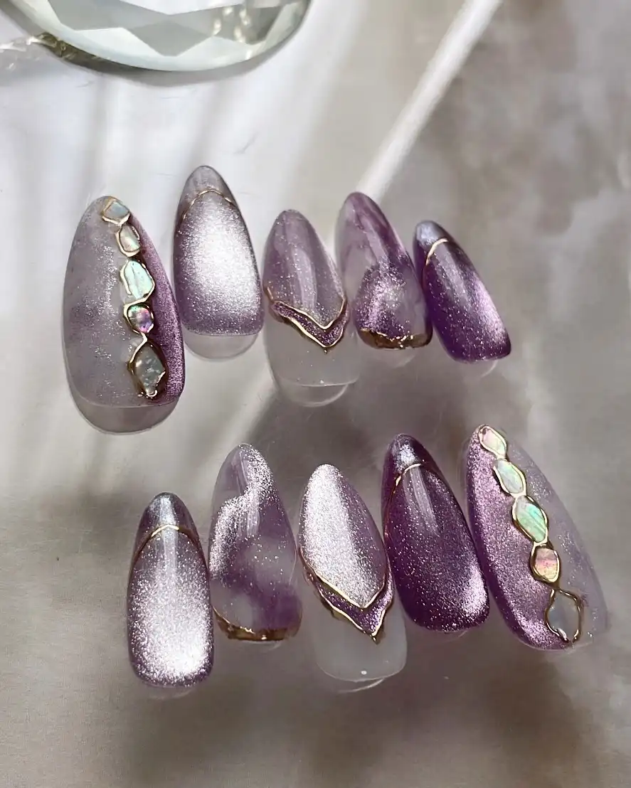 Purple-silver shimmer set with gold edging and iridescent stones