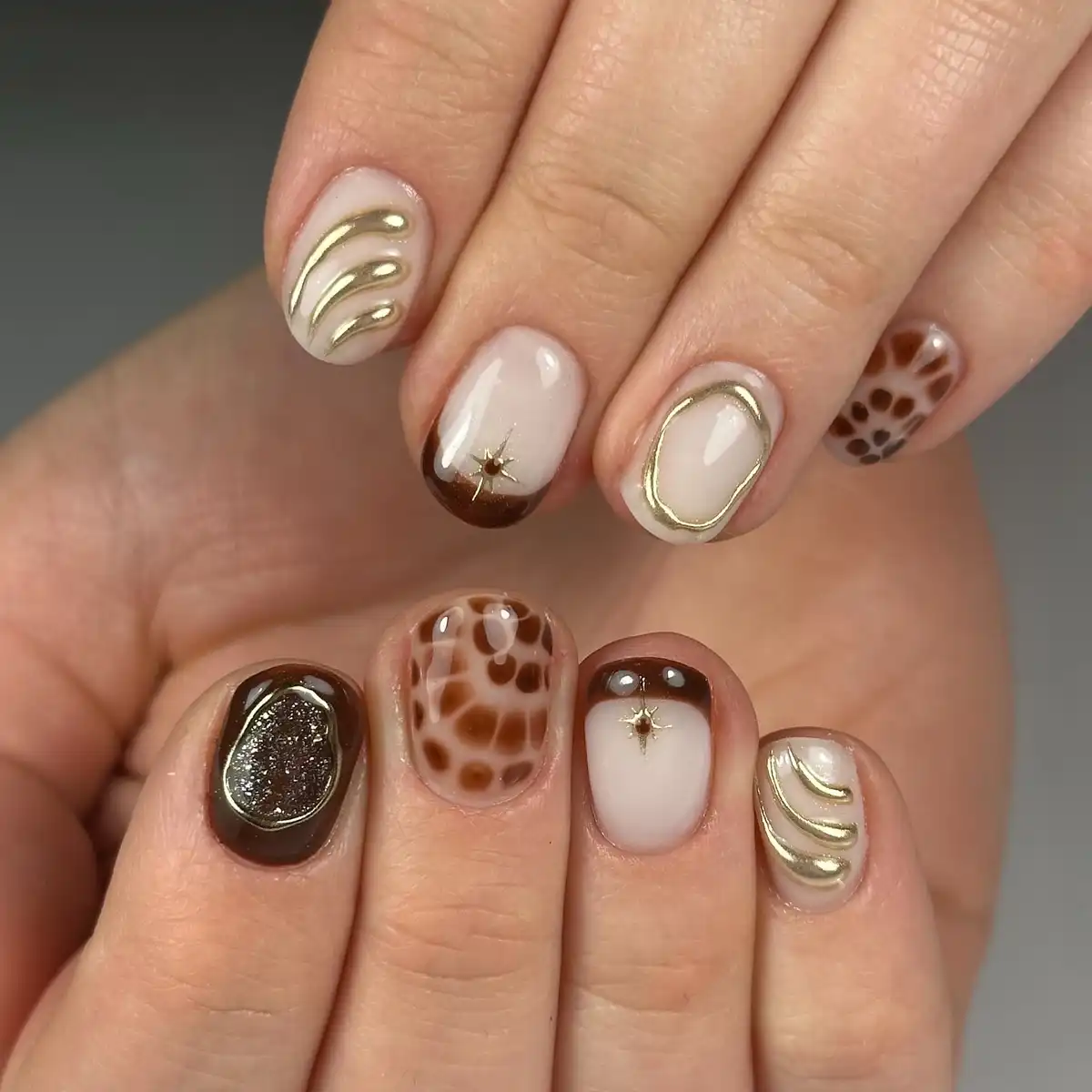 Cream, brown, and gold with raised-line accents