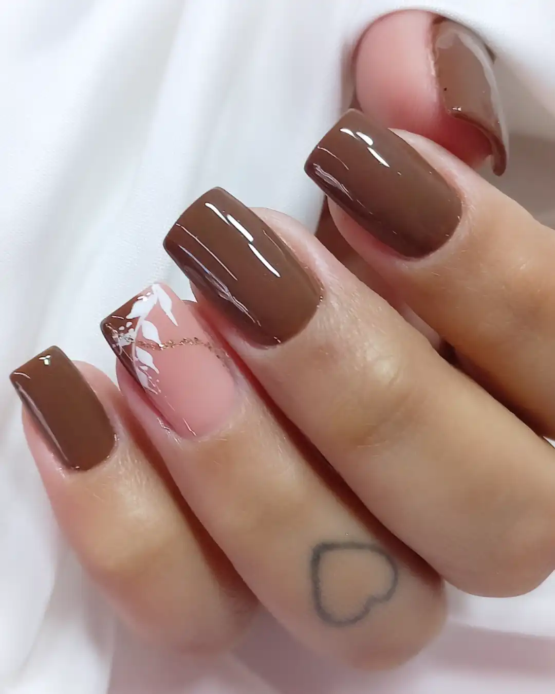 Glossy medium brown with a nude accent and fine detailing