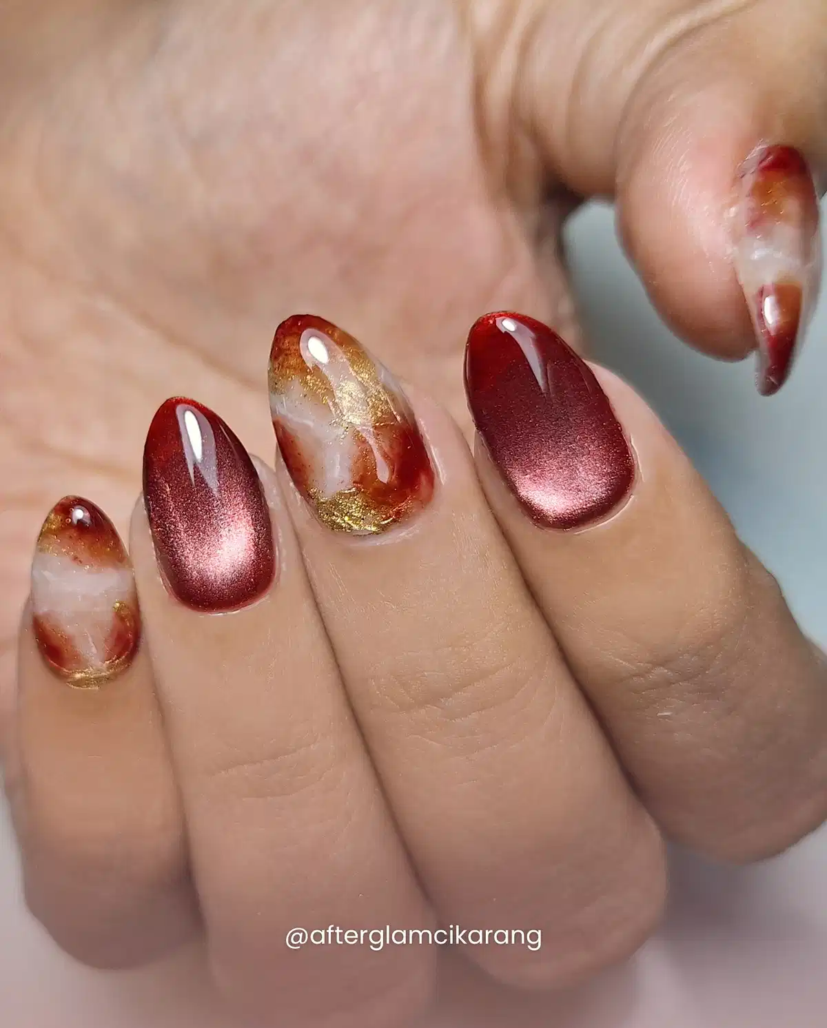 Metallic maroon with marbled gold accents