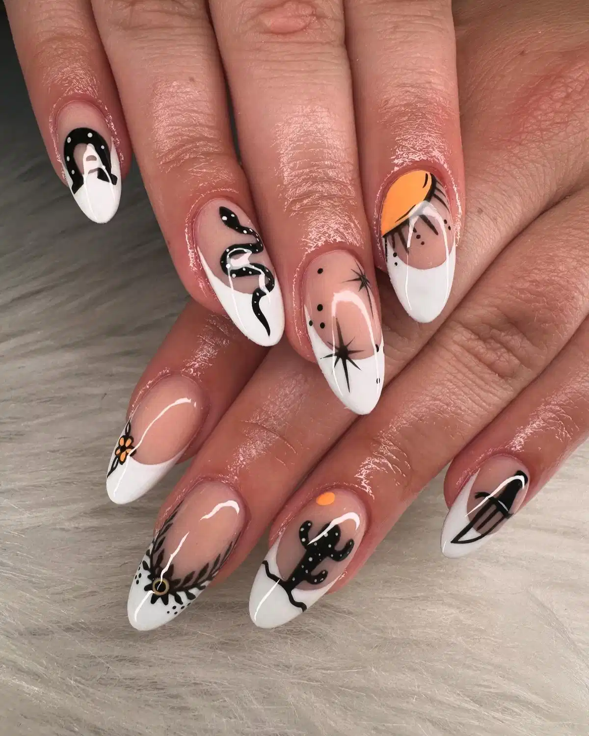 Nude-and-white French tips with black western graphics