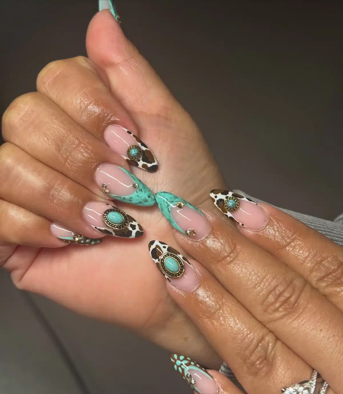 Nude pink with turquoise marbling, cow print, and oval framed accents