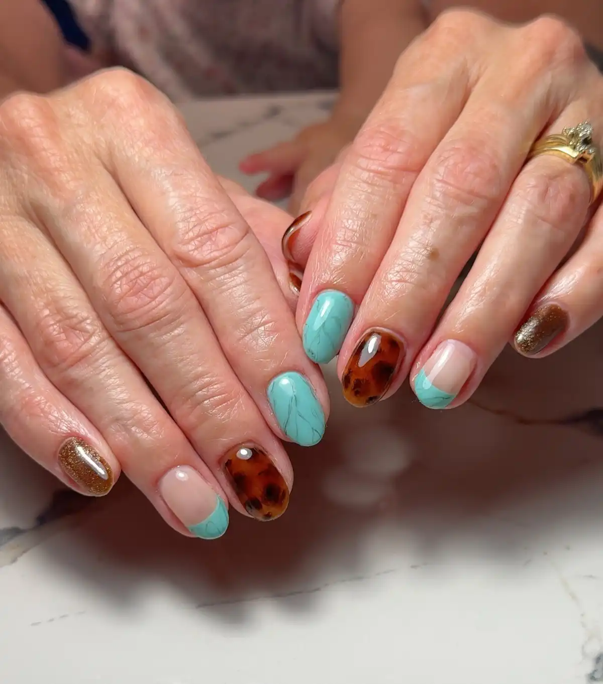Mint marbling with tortoiseshell-style accents and pearl-like studs