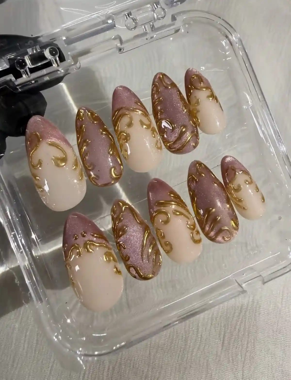 Mauve shimmer and nude set with raised gold swirls