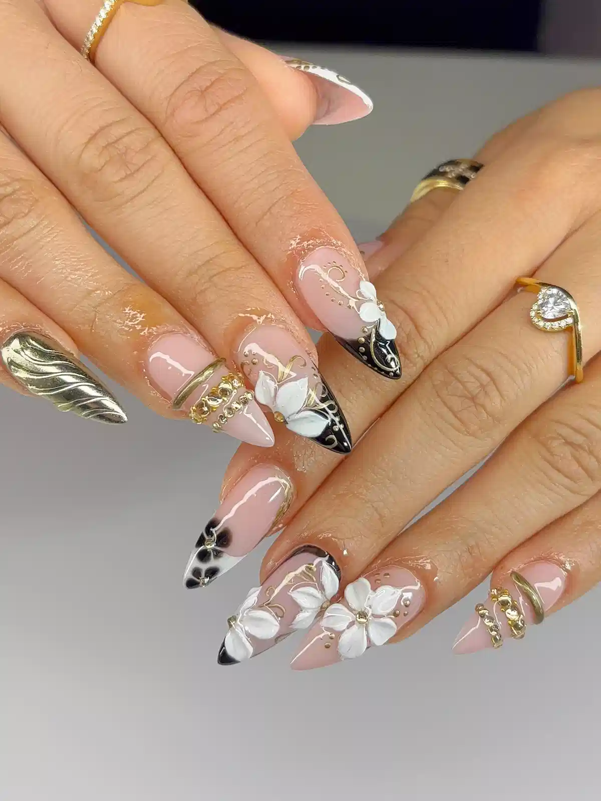 3D white flowers with black tips and gold chain accents
