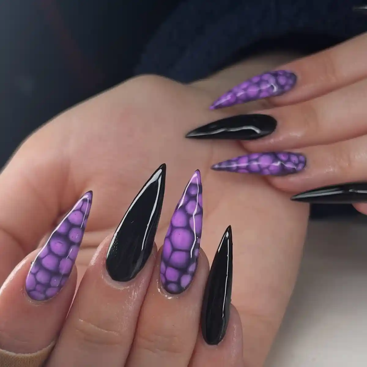 Black stilettos with purple scale-pattern accents