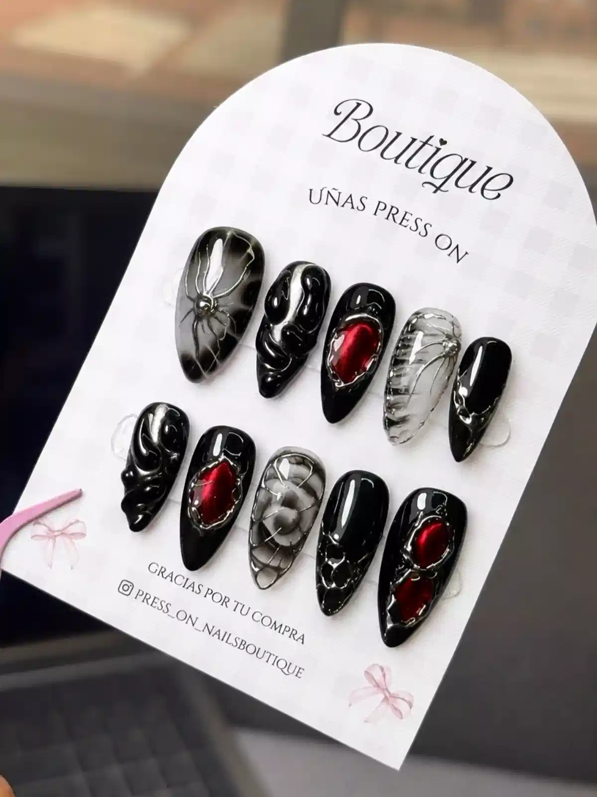 Glossy black set with web lines and red oval accents