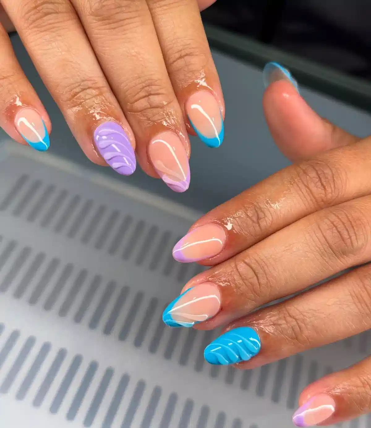Nude with Blue Tips Plus Raised Wavy-Texture Accent Nails