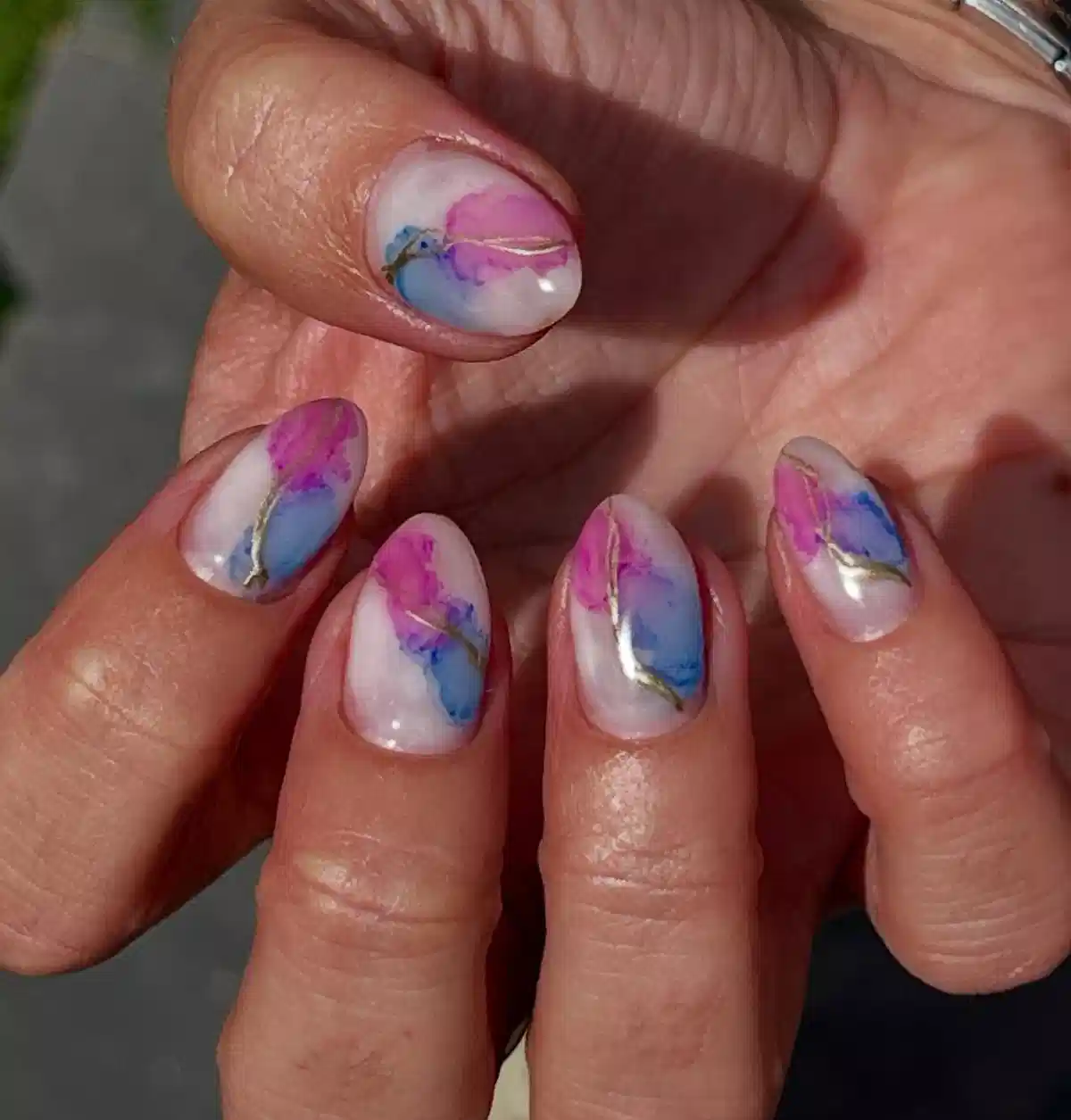 Milky White Base with Pink/Blue-Purple Patches and Gold Lines
