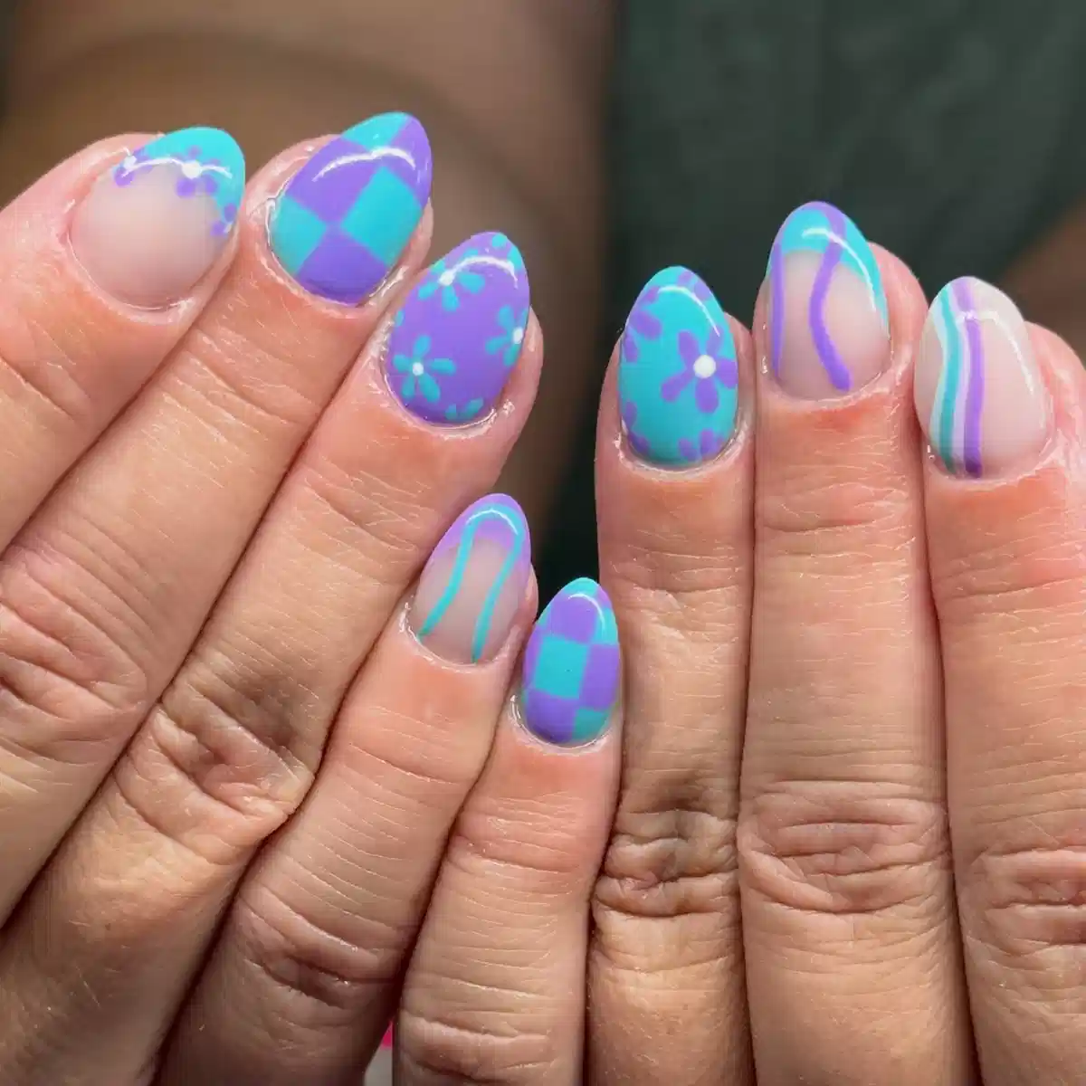 Teal and purple mix: checkerboard, flowers, and curved stripes