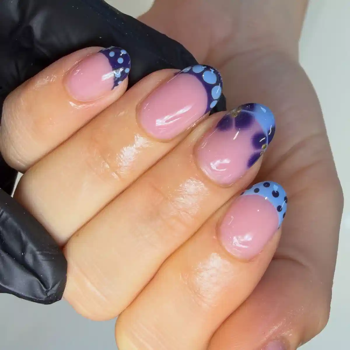 Pink base with blue/purple French tips and dot accents