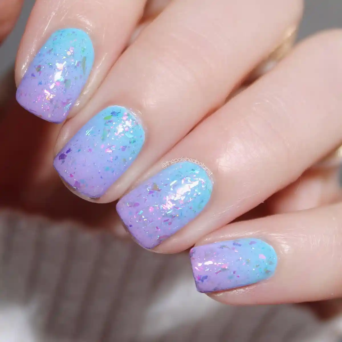 Pastel blue-lavender gradient with reflective flakes