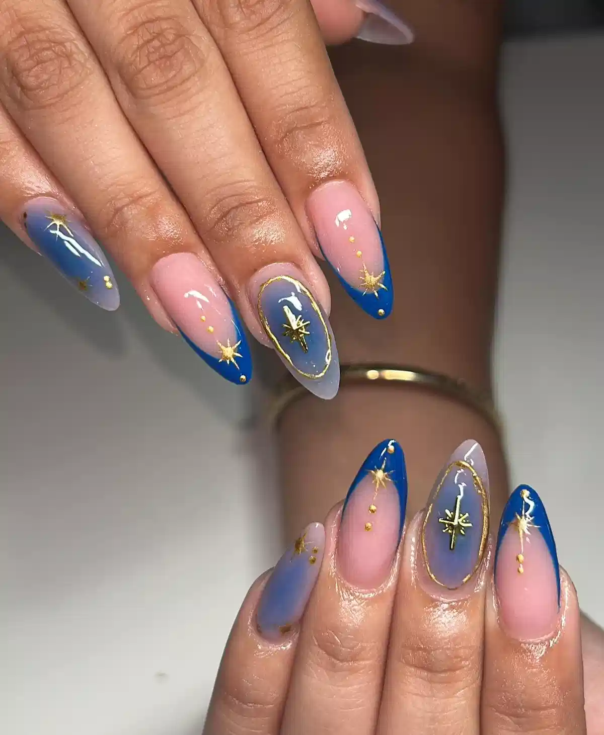 Pink-to-blue tips with gold starbursts