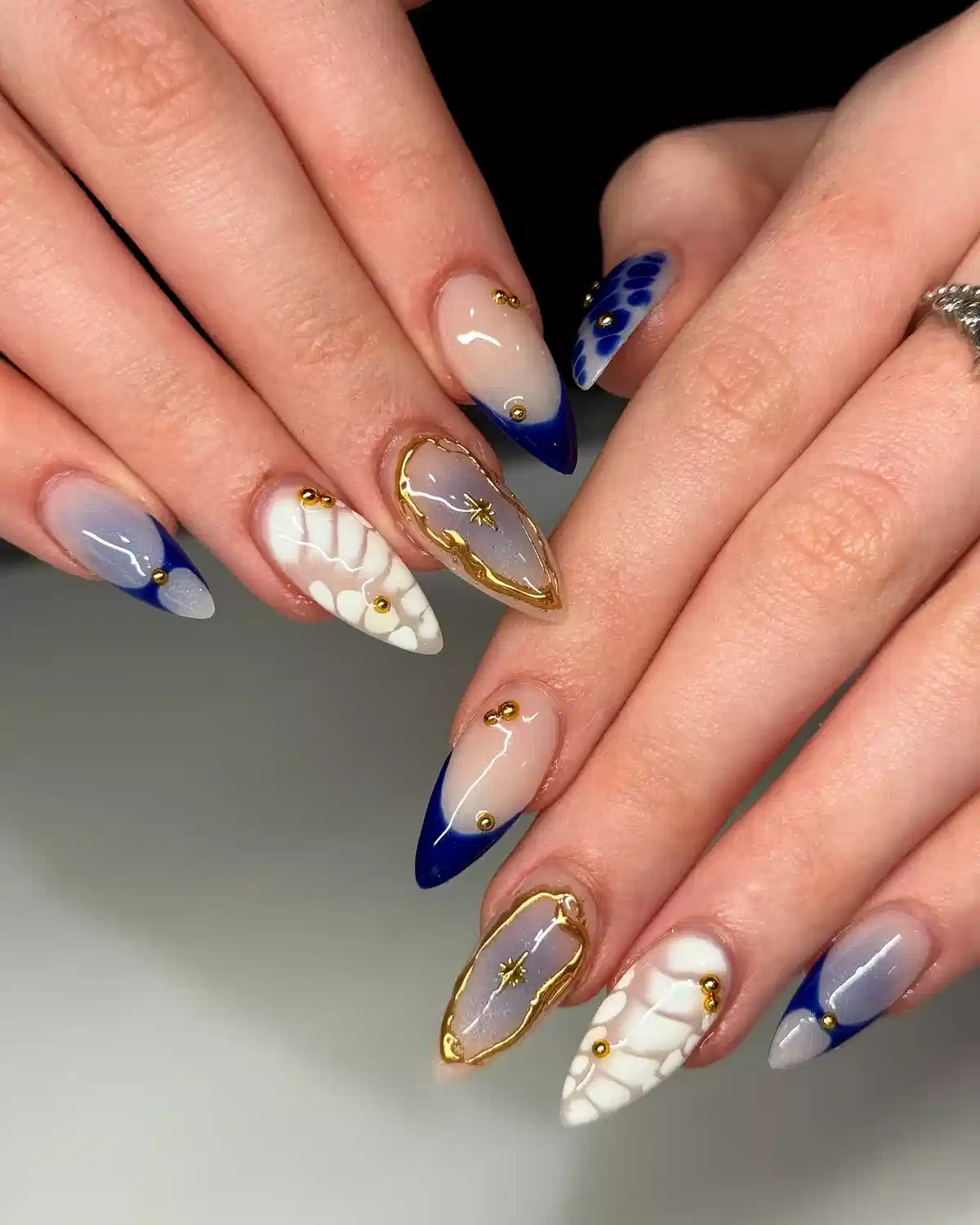 Mixed blue tips, mosaic accents, and gold-studded details
