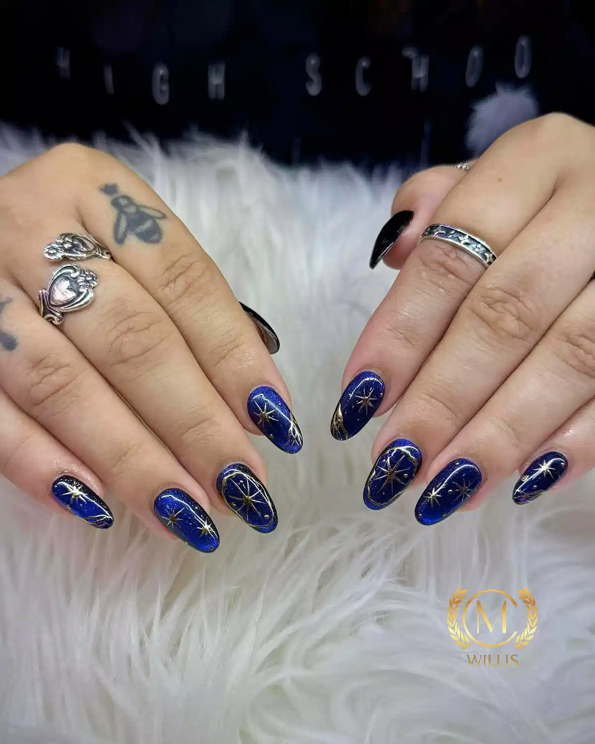Sparkly deep blue with gold starbursts and linework