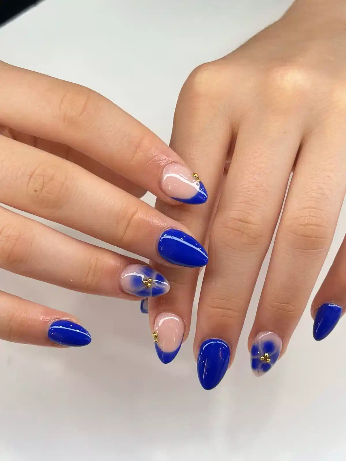 Bright blue solids with floral accent and gold studs