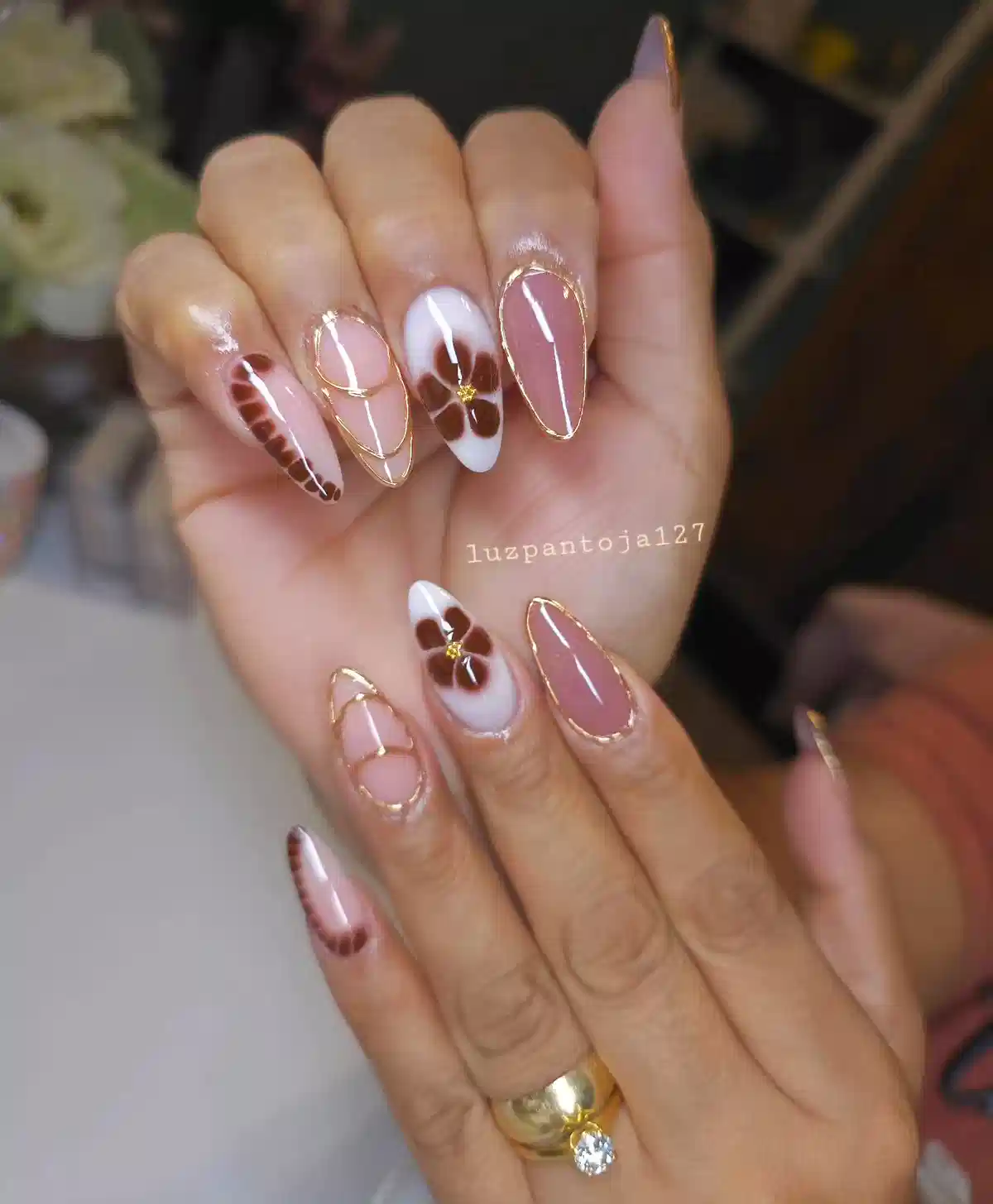 Gold-outlined nude set with brown flower accents