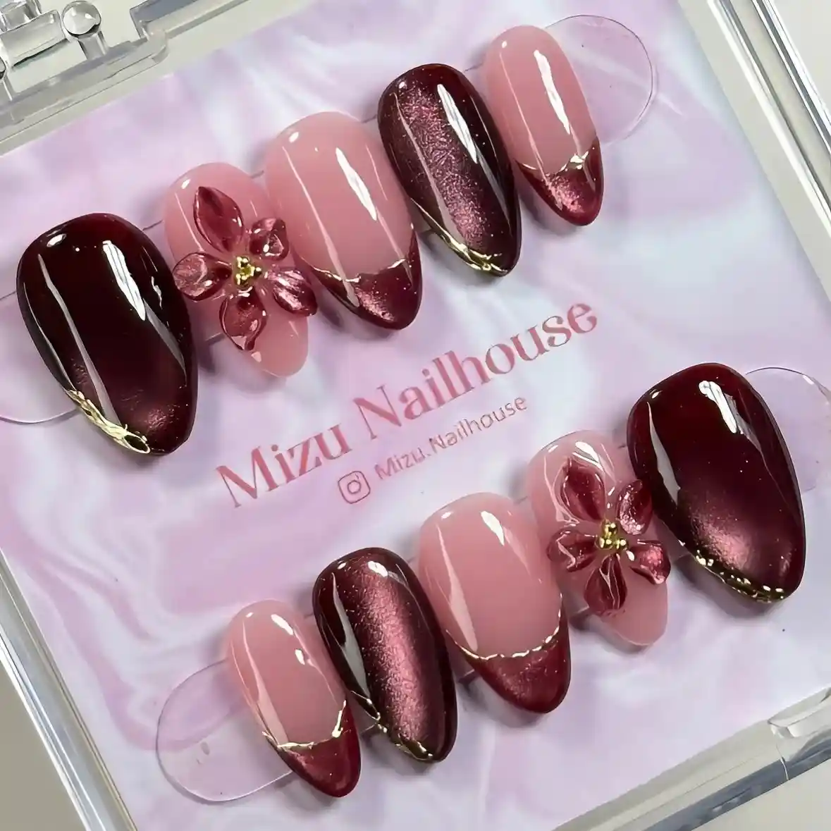 Burgundy and nude-pink press-on set with French tips and 3D flowers