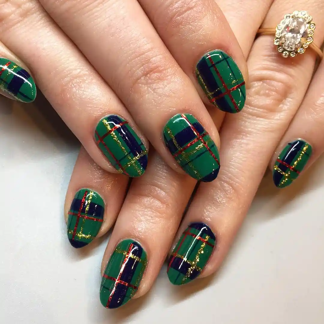 Green-and-navy plaid with red lines and gold glitter accents