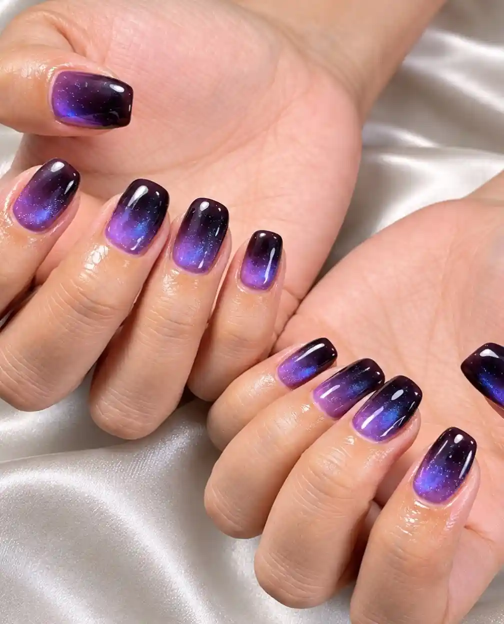 Glossy dark-to-purple-blue gradient on square nails
