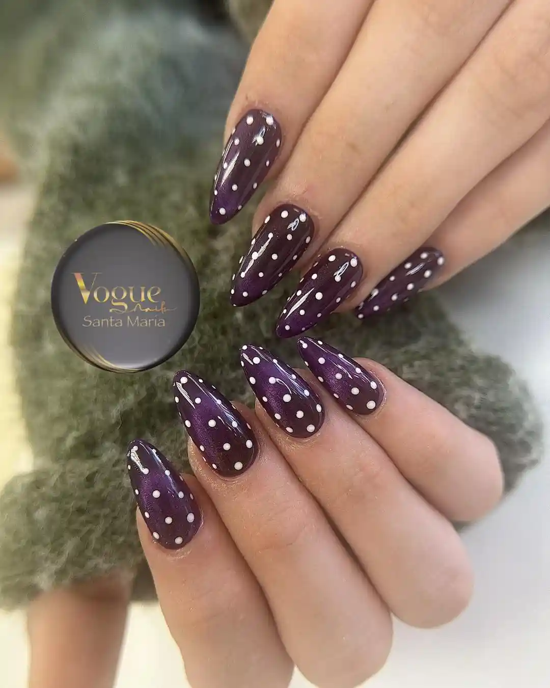 Glossy deep purple polka-dot nails