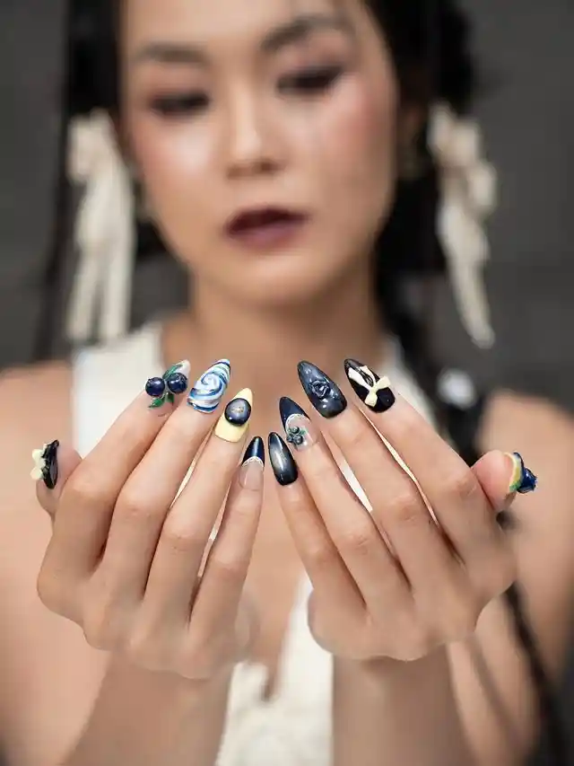 Black, cream, and blue mix with swirls and 3D accents
