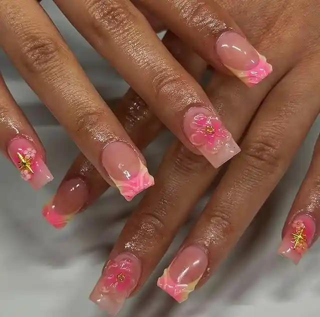Square pink gradient French tips with floral accents