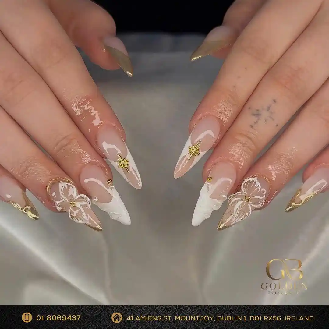 Nude and white nails with gold star charms