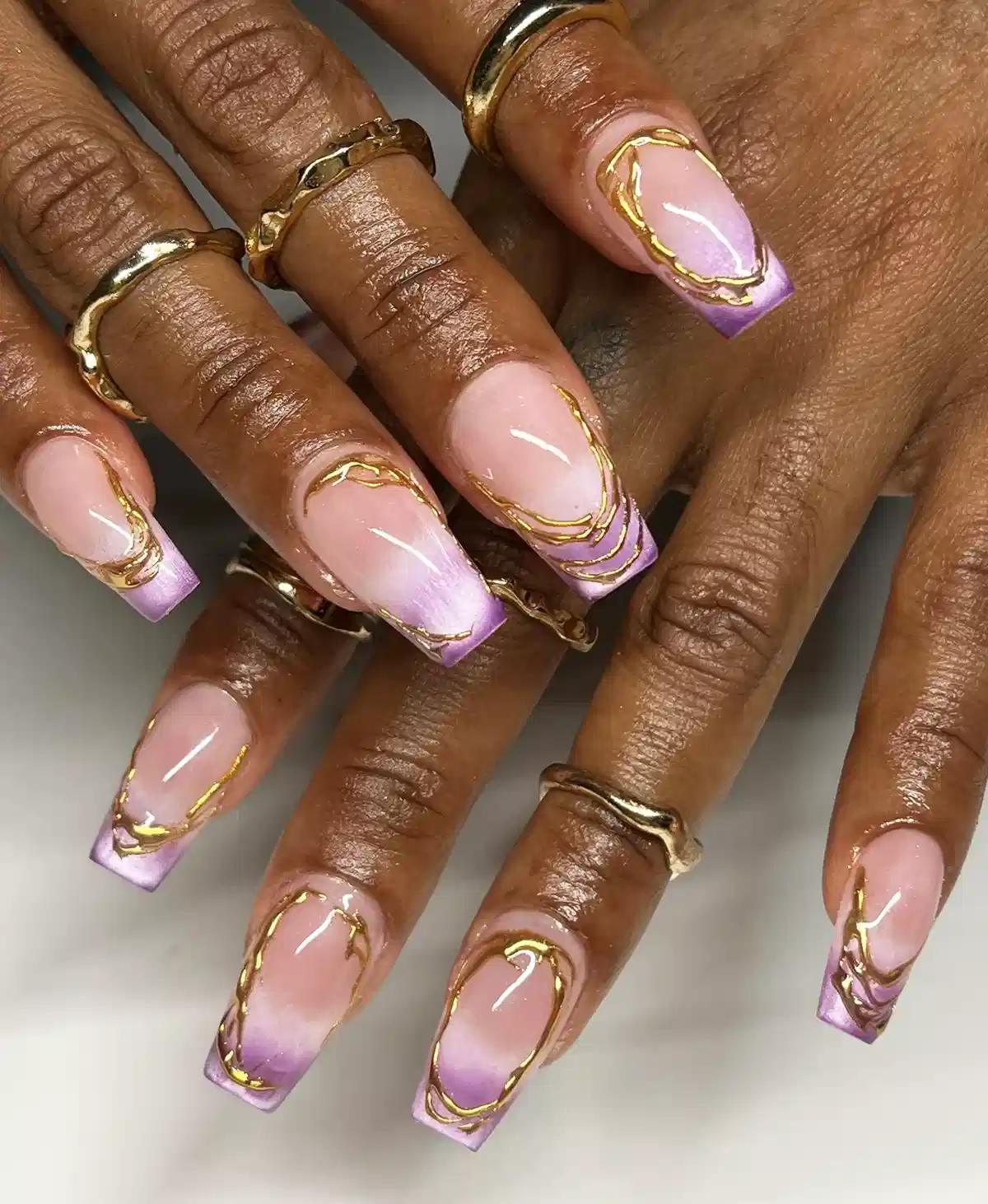 Lavender ombré tips with raised gold linework