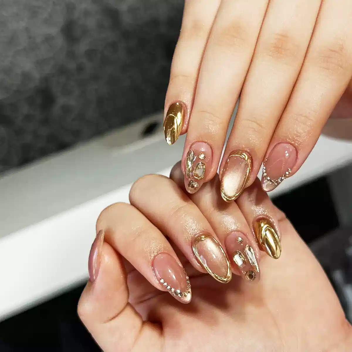 Gold Framed Almond Nails with Rhinestone Details