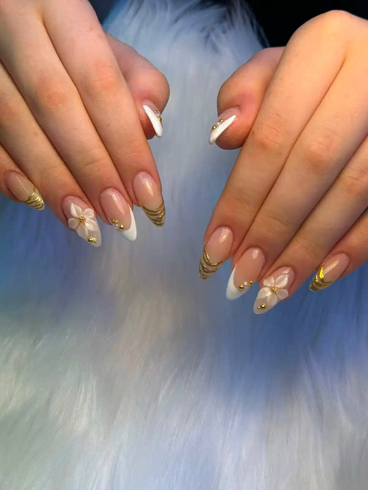 White-Tipped Almond Nails with Gold Striping and 3D Flower