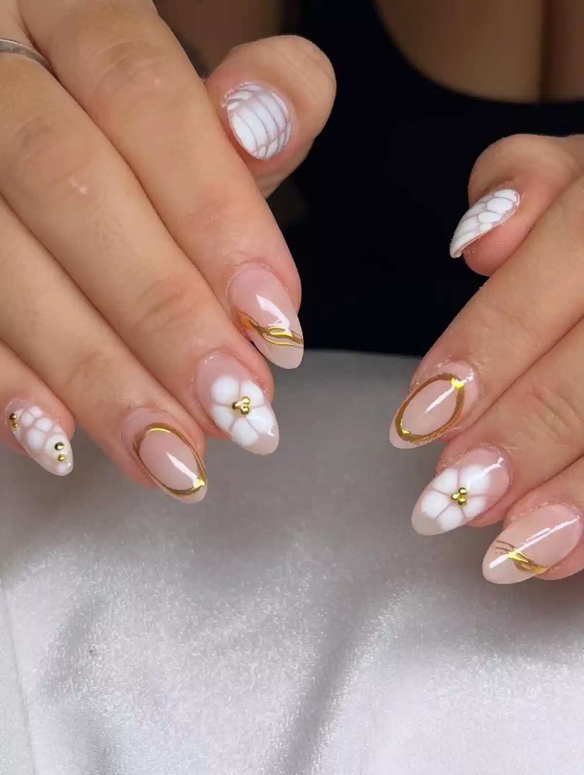 3D White Flowers with Gold Outlines on Almond Nails