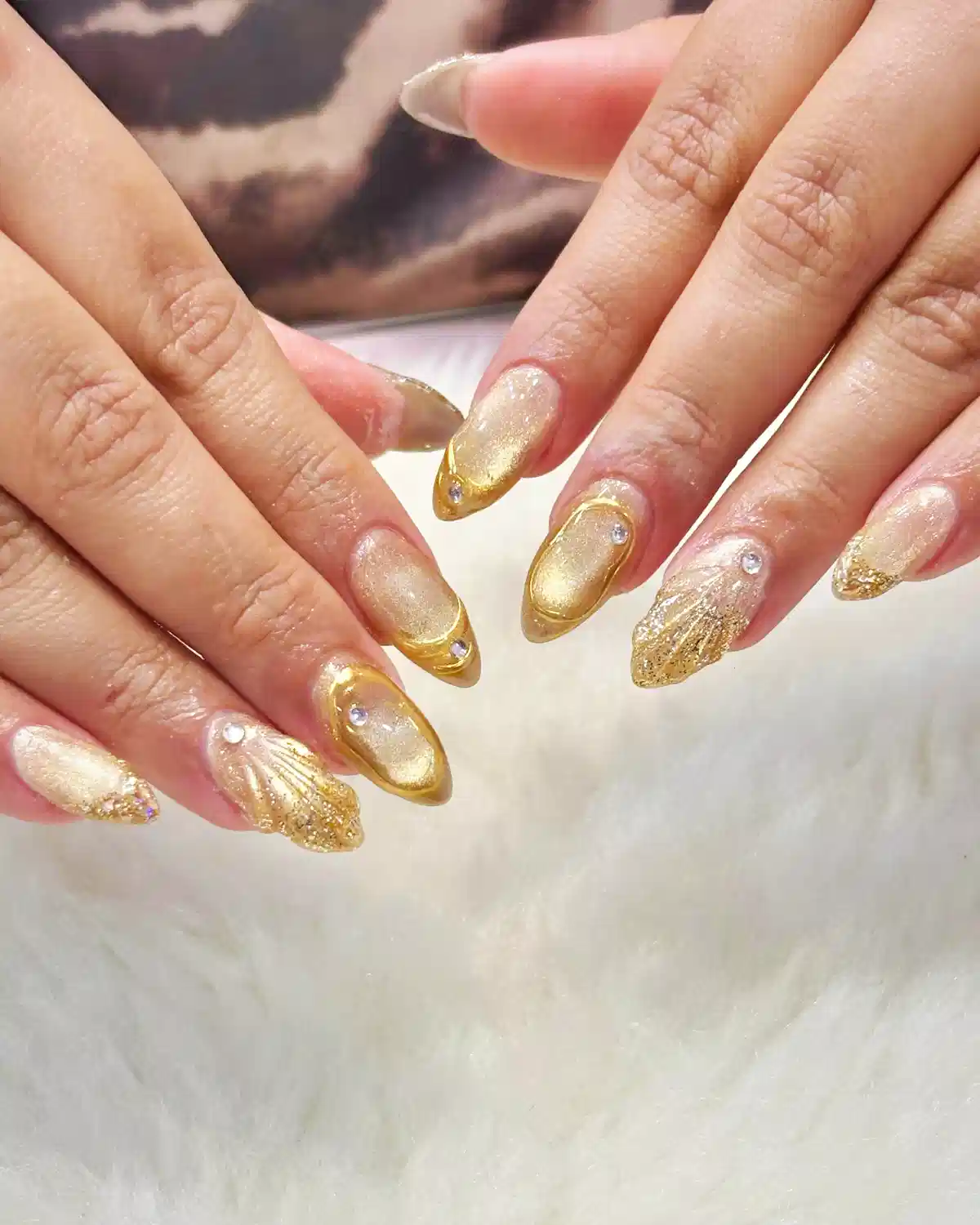 Gold gradient almond nails with rhinestones