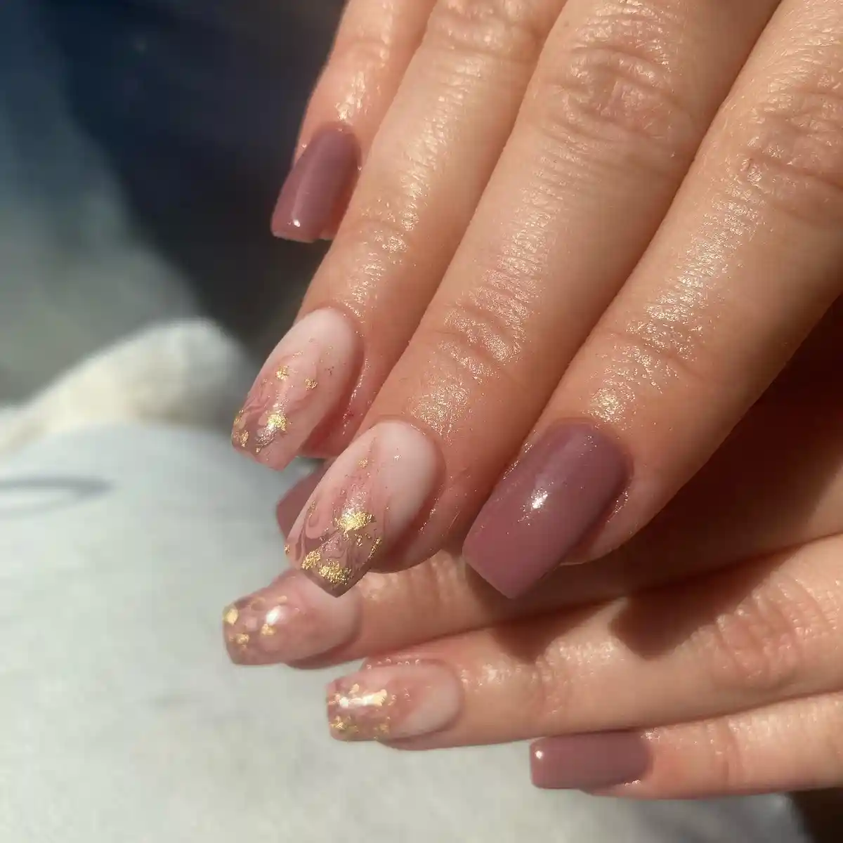 Mauve solids with sheer nude accent nails featuring gold and subtle line art