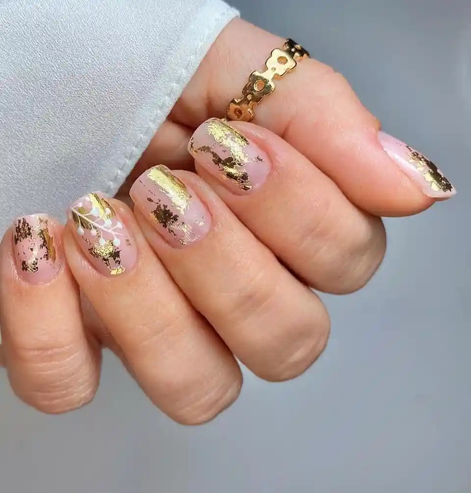 Pale pink base with scattered gold accents and white line art