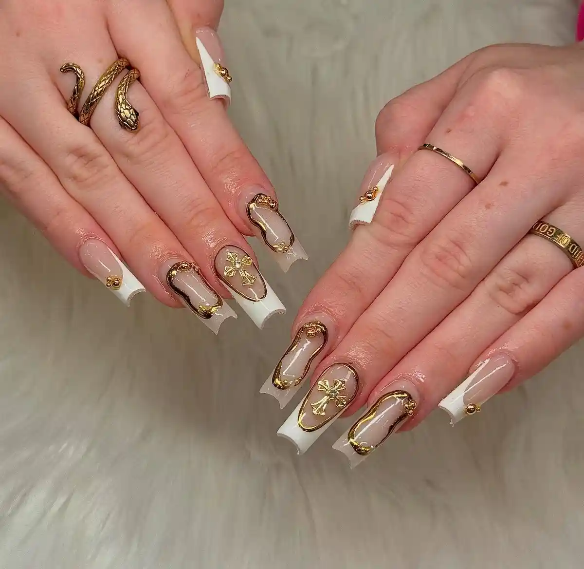 White French tips with raised gold frames and cross accents