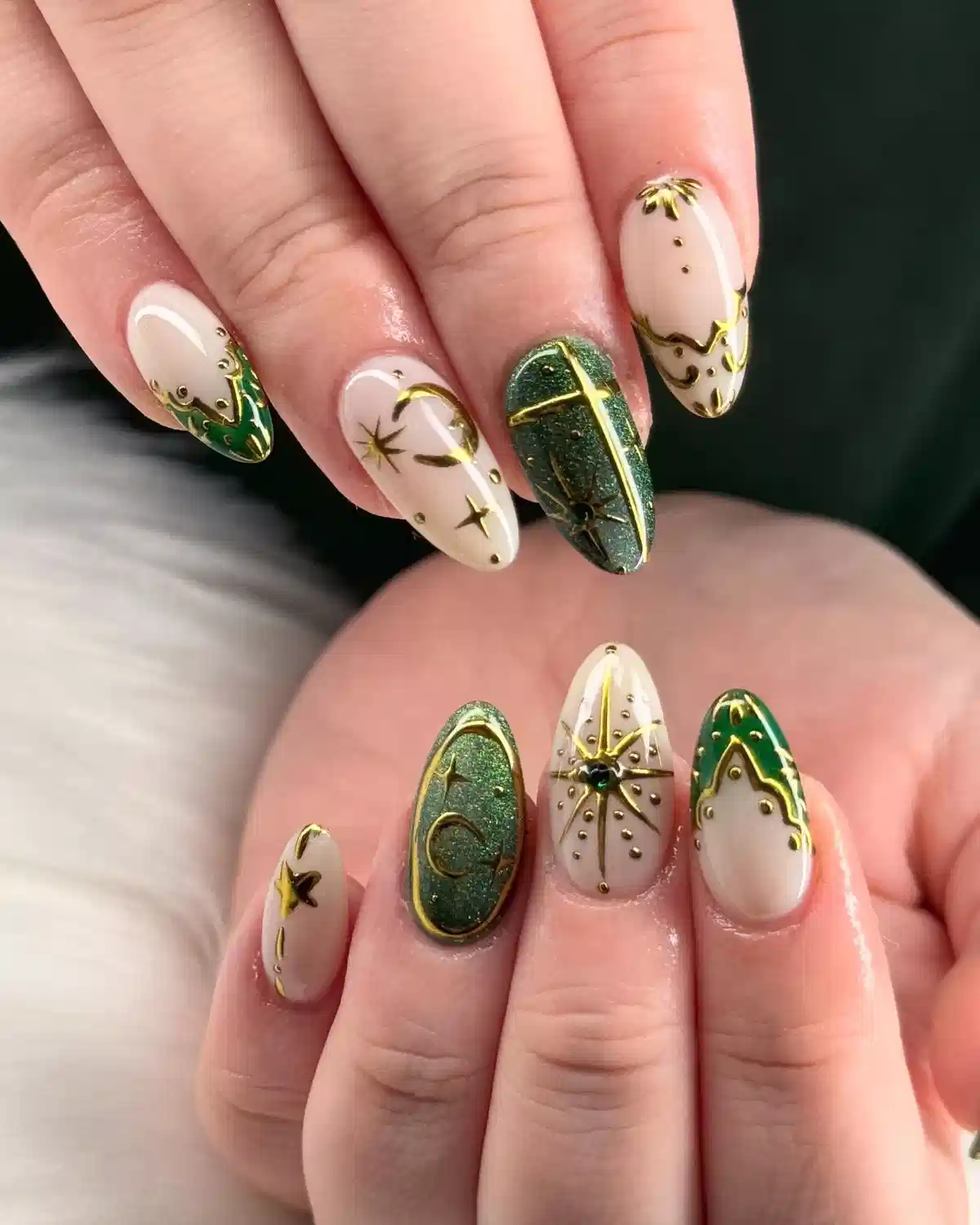 Nude and Green Glitter Nails with Gold Linework and Stars