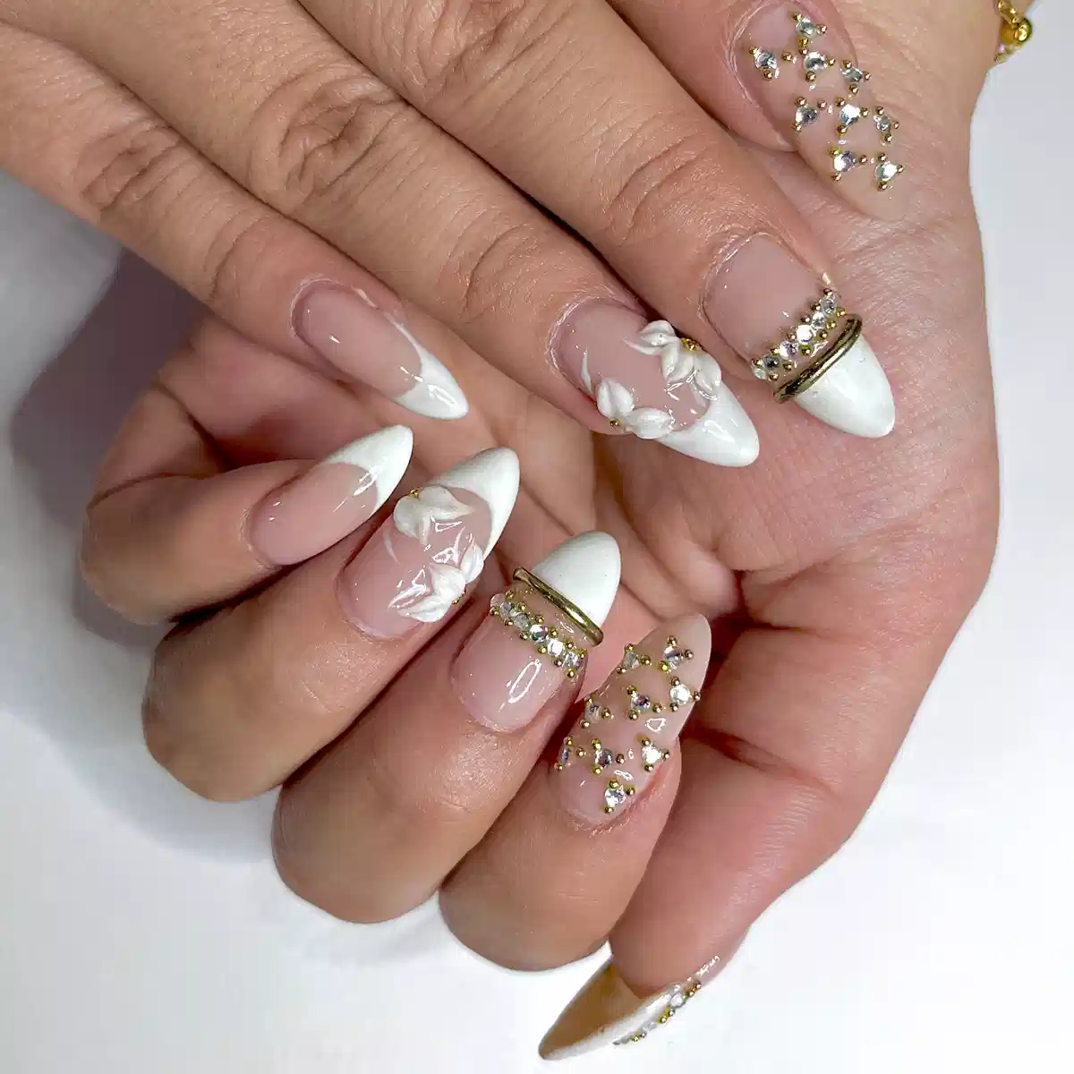 White French tips with rhinestones and raised florals