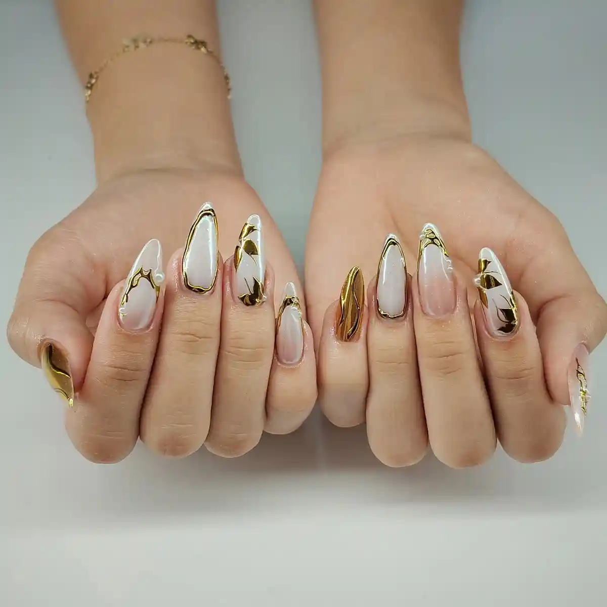 White and gold metallic-edged set with pearl-like accents