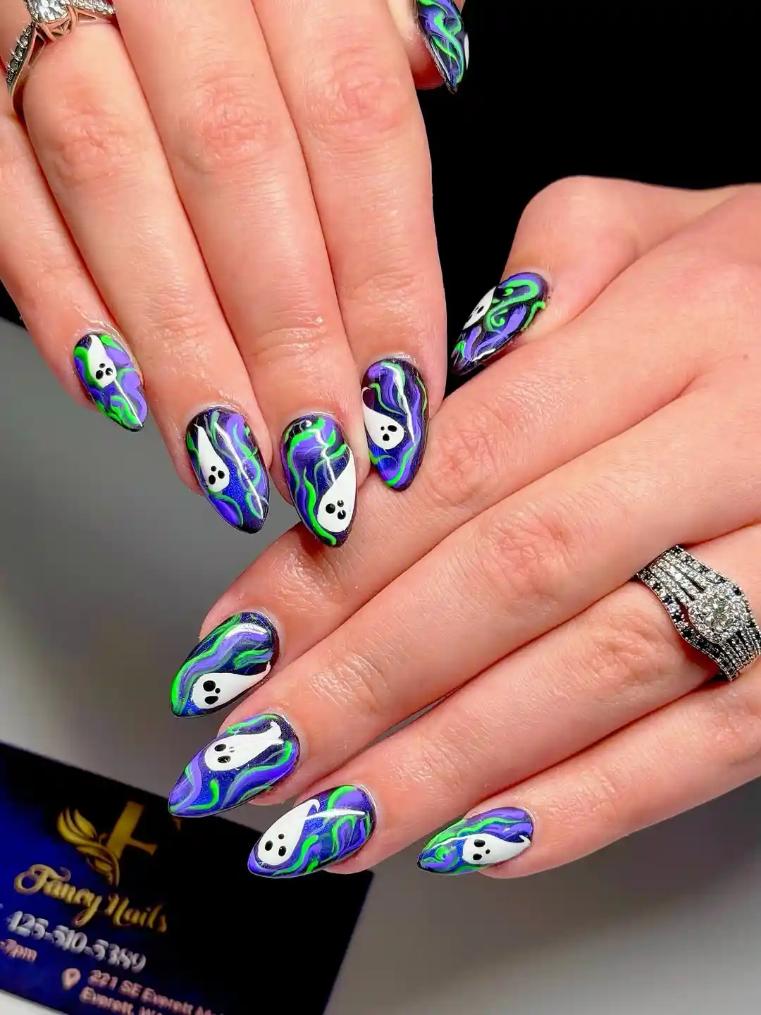 Purple-green swirls with white ghost accents