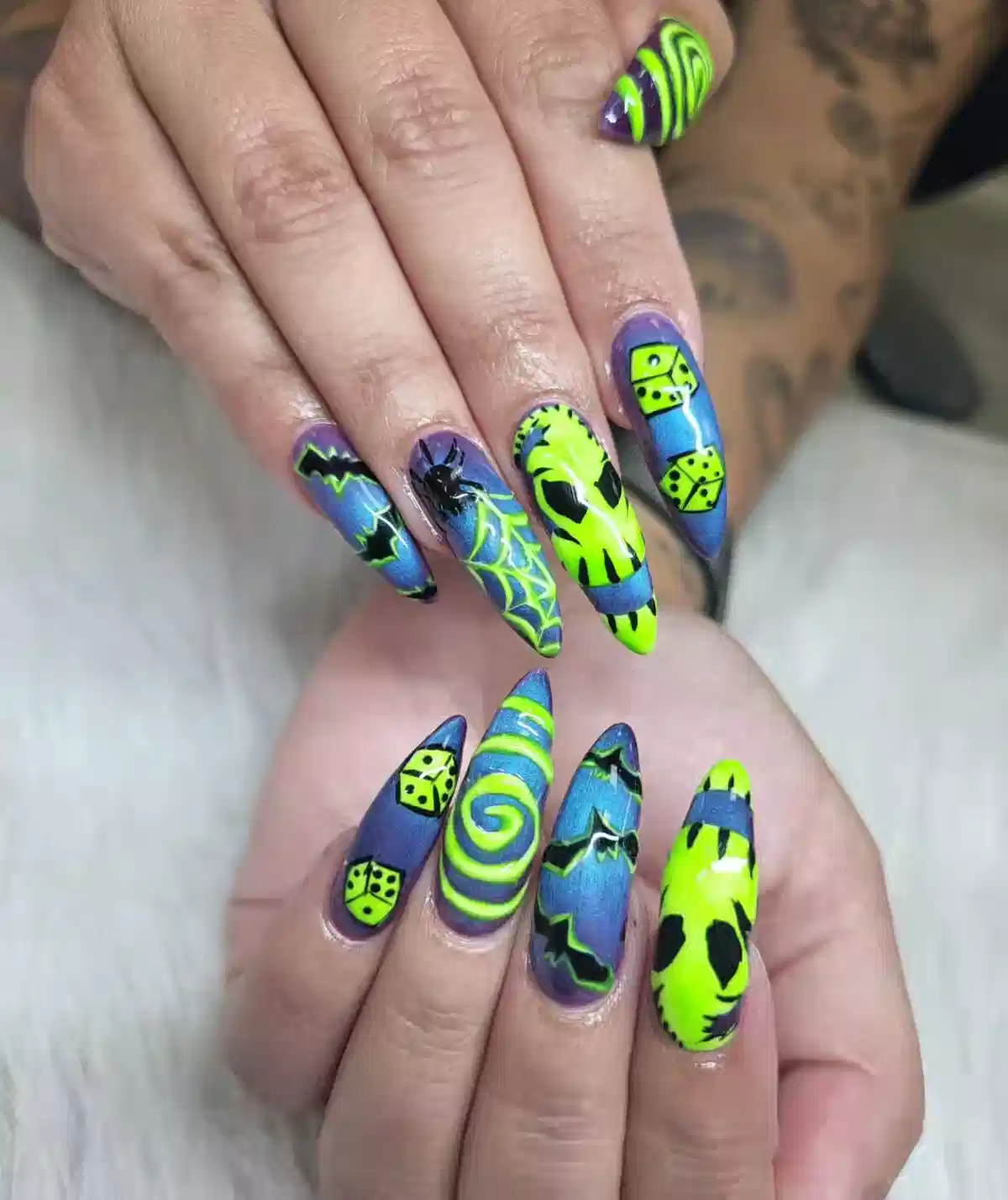 Purple-blue set with neon green graphics (webs, dice, spiral)